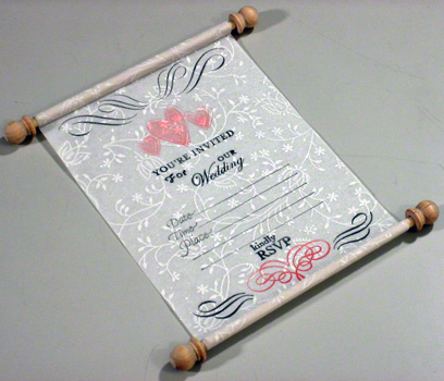 Announce you want to "roll out the white carpet" by making a white unique wedding invitation that rolls up like a royal scroll. Also